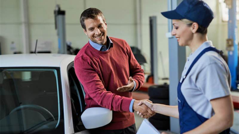 Customer shaking hands with an auto service provider